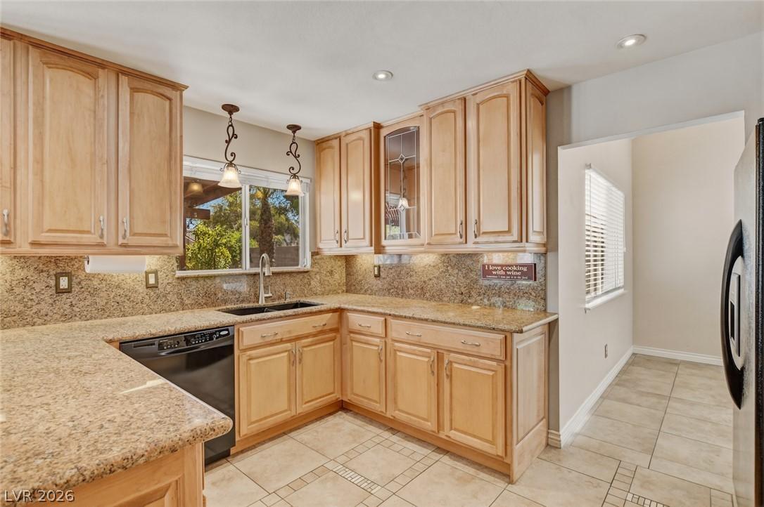 Image 2: Well-lit kitchen with generous countertop space an
