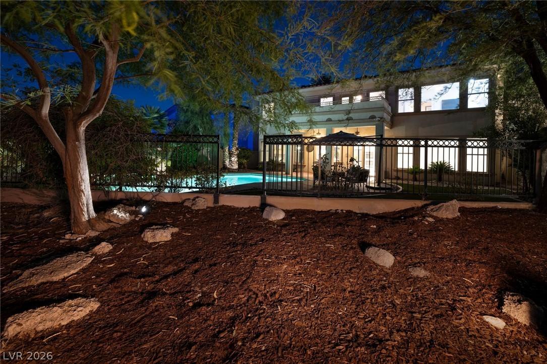 Image 3: A private backyard oasis with sparkling pool and i