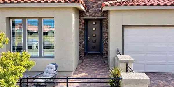Image 4: A welcoming stone-accented entryway features a war