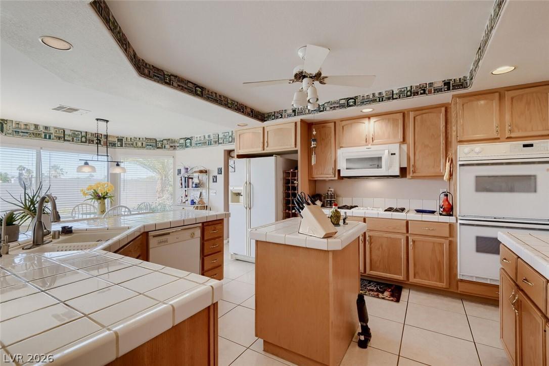 Image 4: A well-equipped kitchen featuring abundant natural
