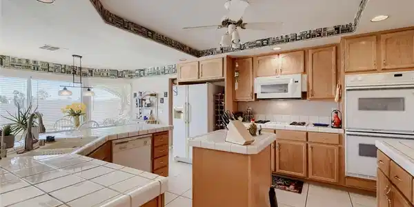 Image 4: A well-equipped kitchen featuring abundant natural