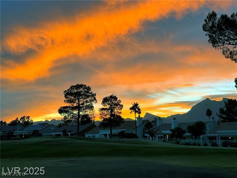 Image 4: Golden hues paint the sky over this community with