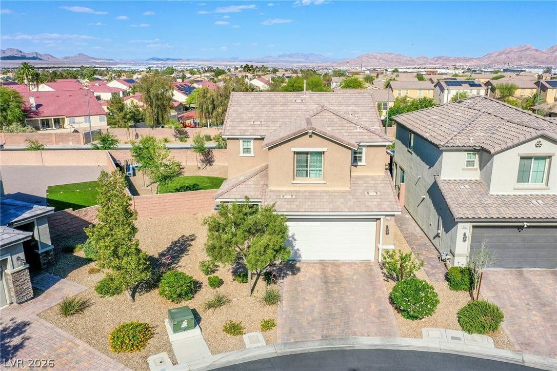 Image 2: This residential property offers a suburban settin