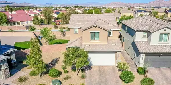 Image 2: This residential property offers a suburban settin