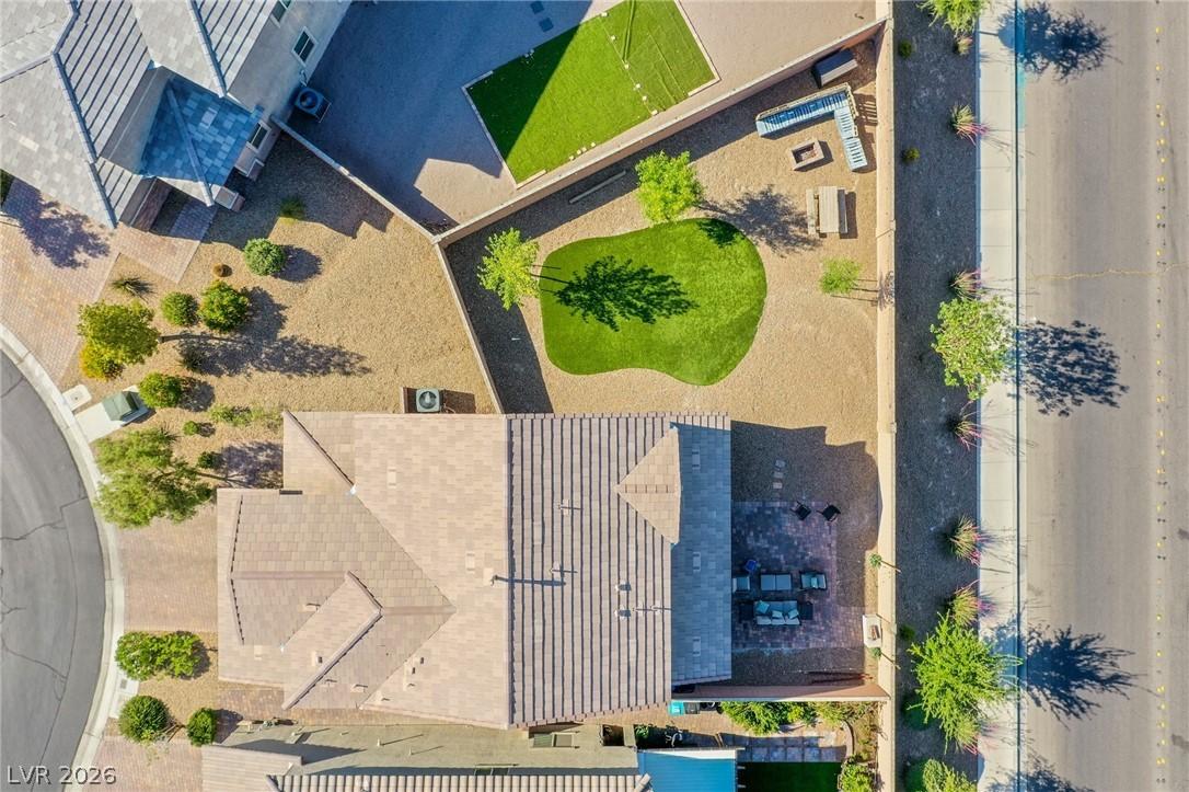 Image 3: An aerial view captures the home's exterior, showc