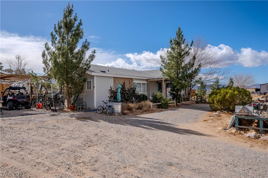 Image 2: This charming residence is nestled among mature tr