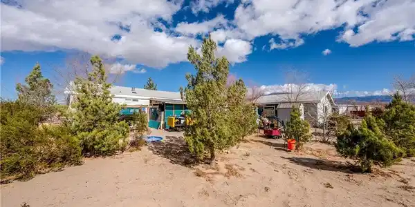 Image 3: This desert landscape features a spacious yard wit