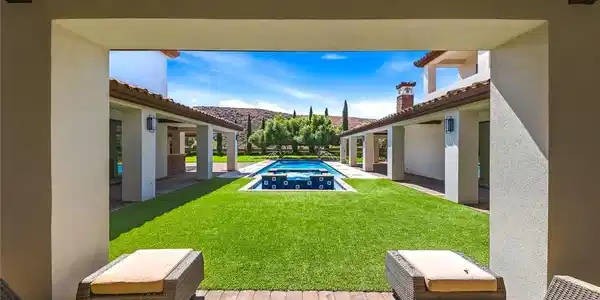 Image 4: Natural light pours into this grand living space w