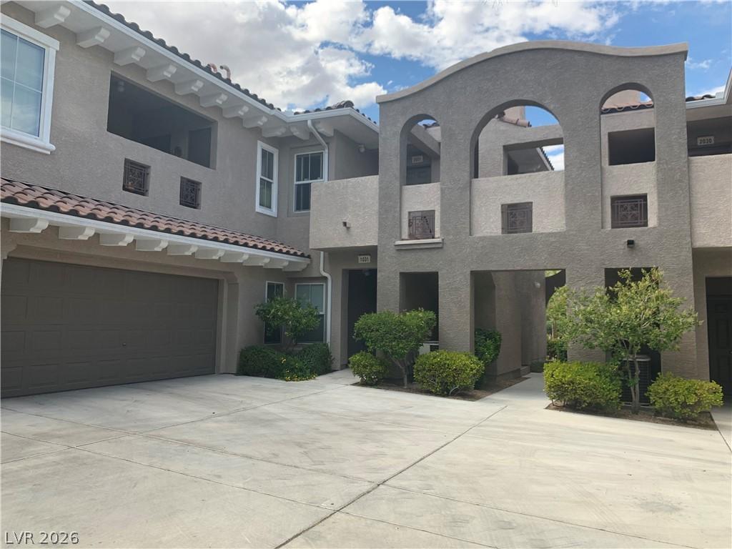 Image 1: Spanish-inspired architecture with stucco finishes