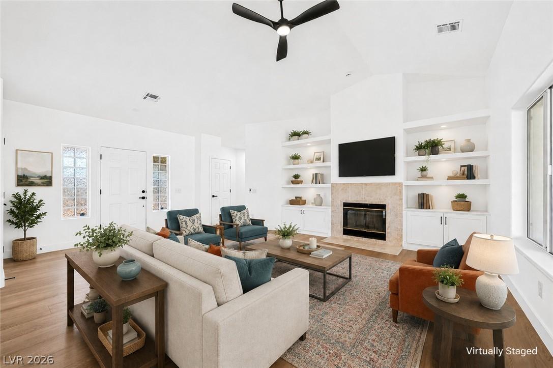 Image 4: The open-concept living space presents high vaulte