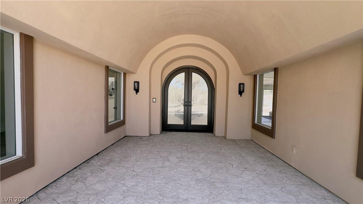 Image 4: Arched entryways and textured flooring define this