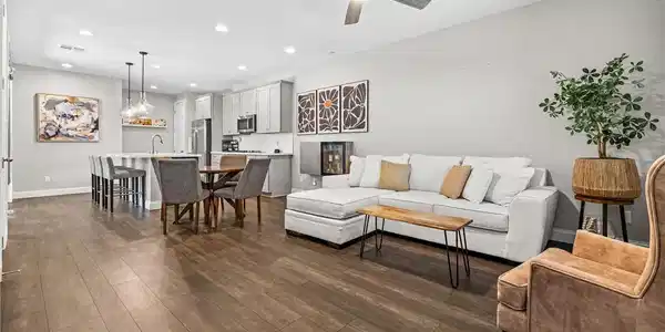 Image 3: This open concept living area seamlessly blends th