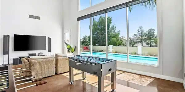 Image 3: This bright living space offers double high ceilin