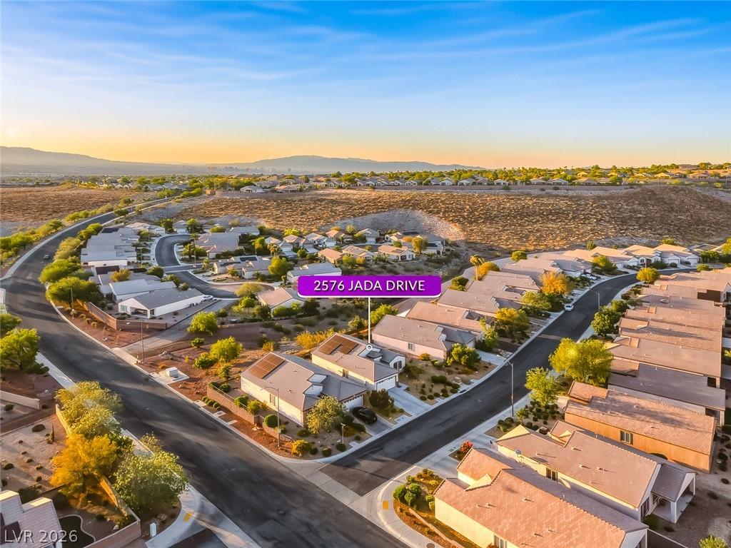 Image 4: An aerial perspective reveals a desert community n