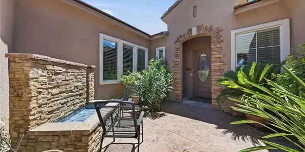 Image 4: An inviting front entry welcomes with a decorative