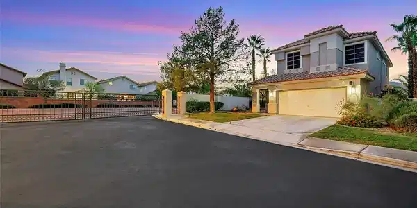 Image 2: View of front of home featuring driveway, a tile r