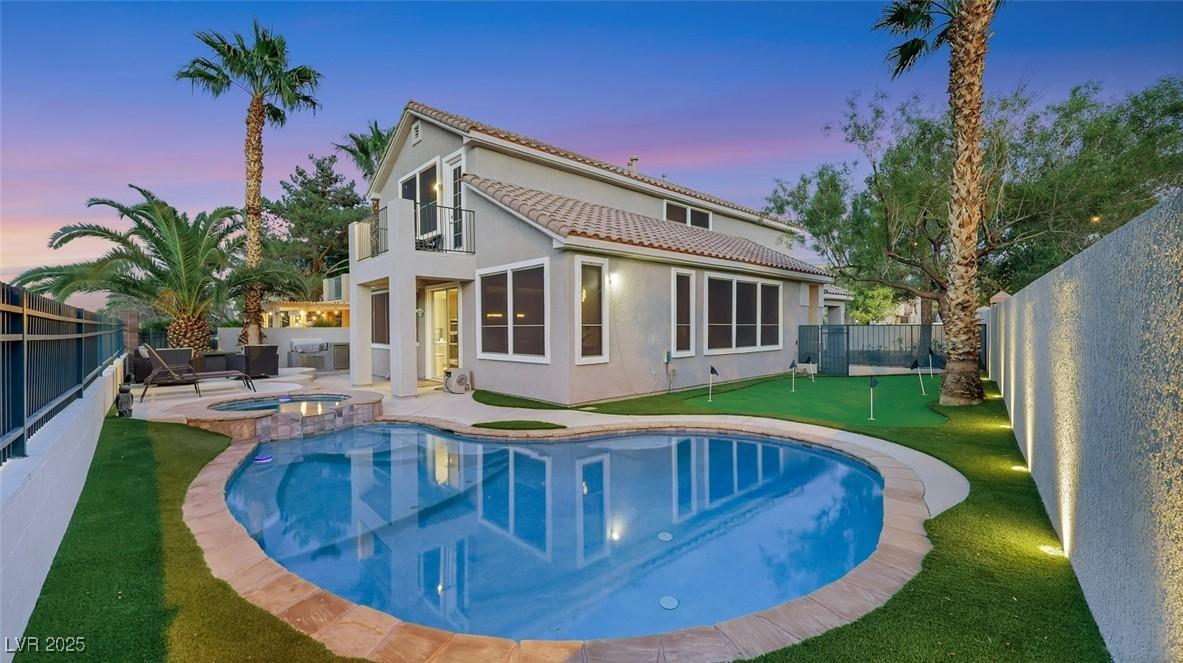 Image 3: Rear view of property with a fenced backyard, a pu
