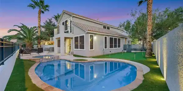 Image 3: Rear view of property with a fenced backyard, a pu