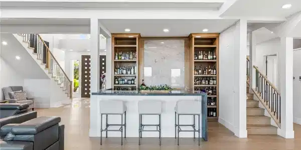Image 4: This bright and open-concept home features a sophi