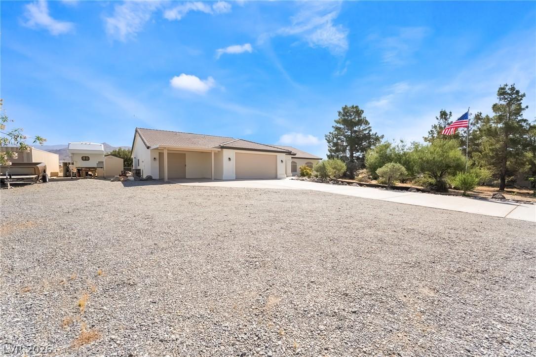 Image 3: This desert retreat features a welcoming facade an
