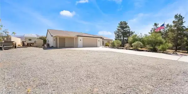 Image 3: This desert retreat features a welcoming facade an