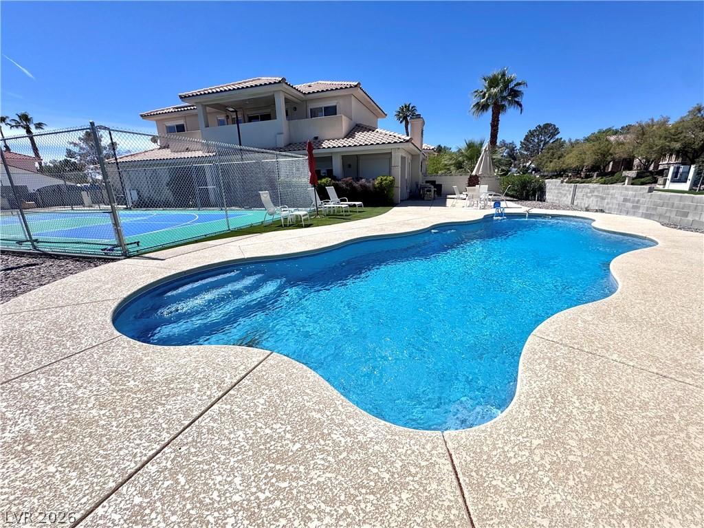 Image 2: View of swimming pool featuring patio surround and