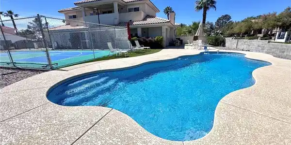 Image 2: View of swimming pool featuring patio surround and