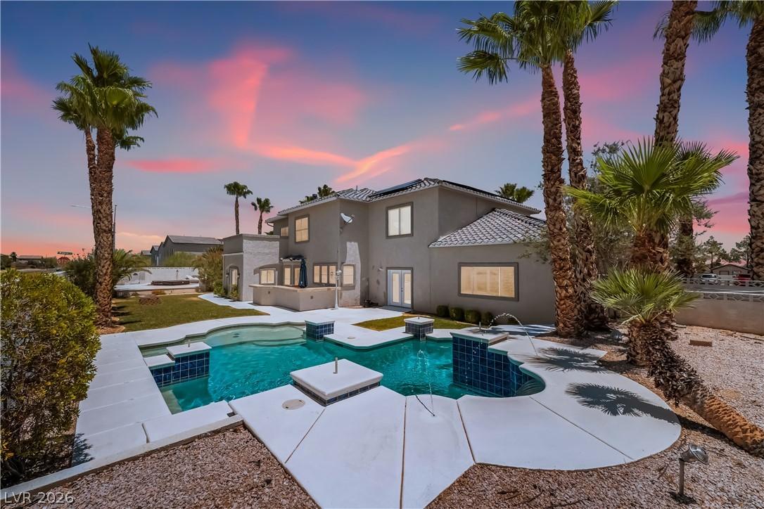 Image 2: An inviting backyard oasis awaits with a sparkling
