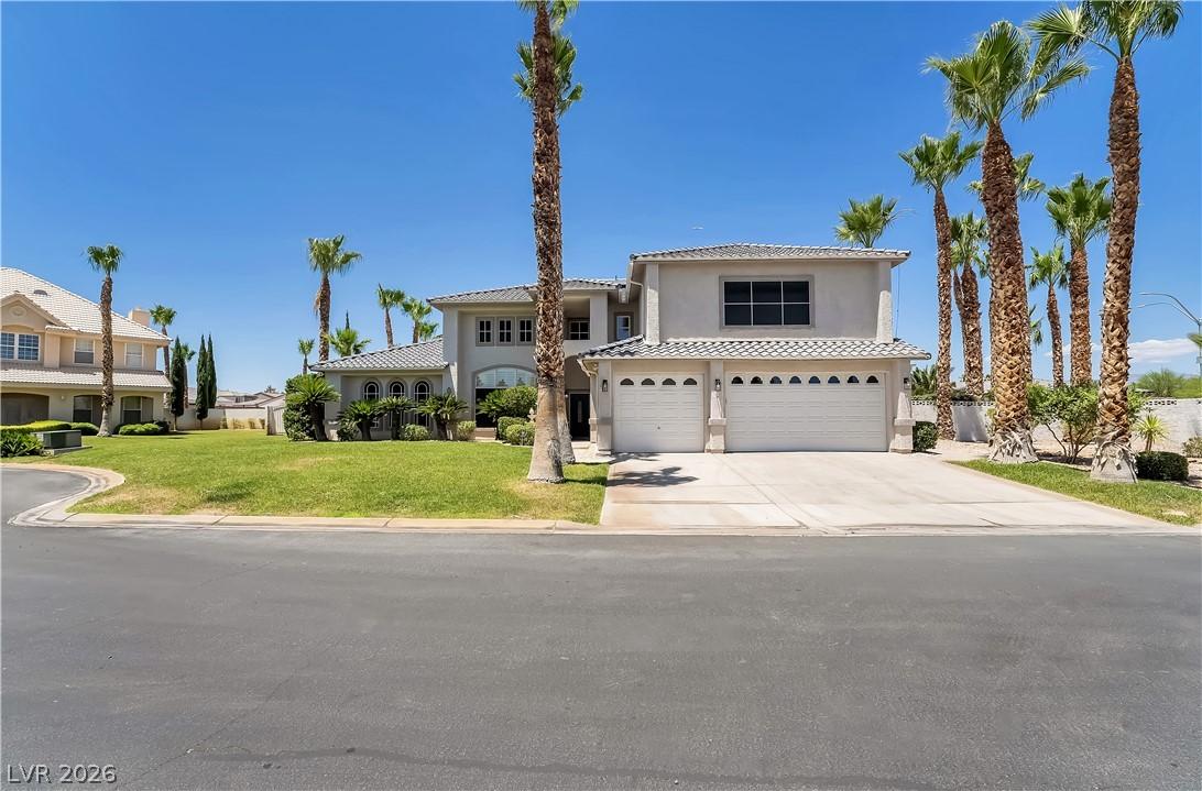 Image 3: A spacious home with an attached two-car garage, s