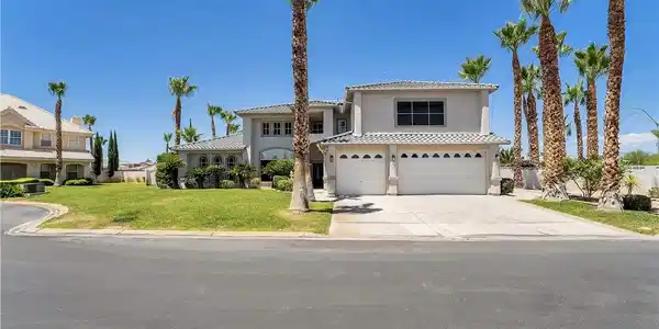 Image 3: A spacious home with an attached two-car garage, s