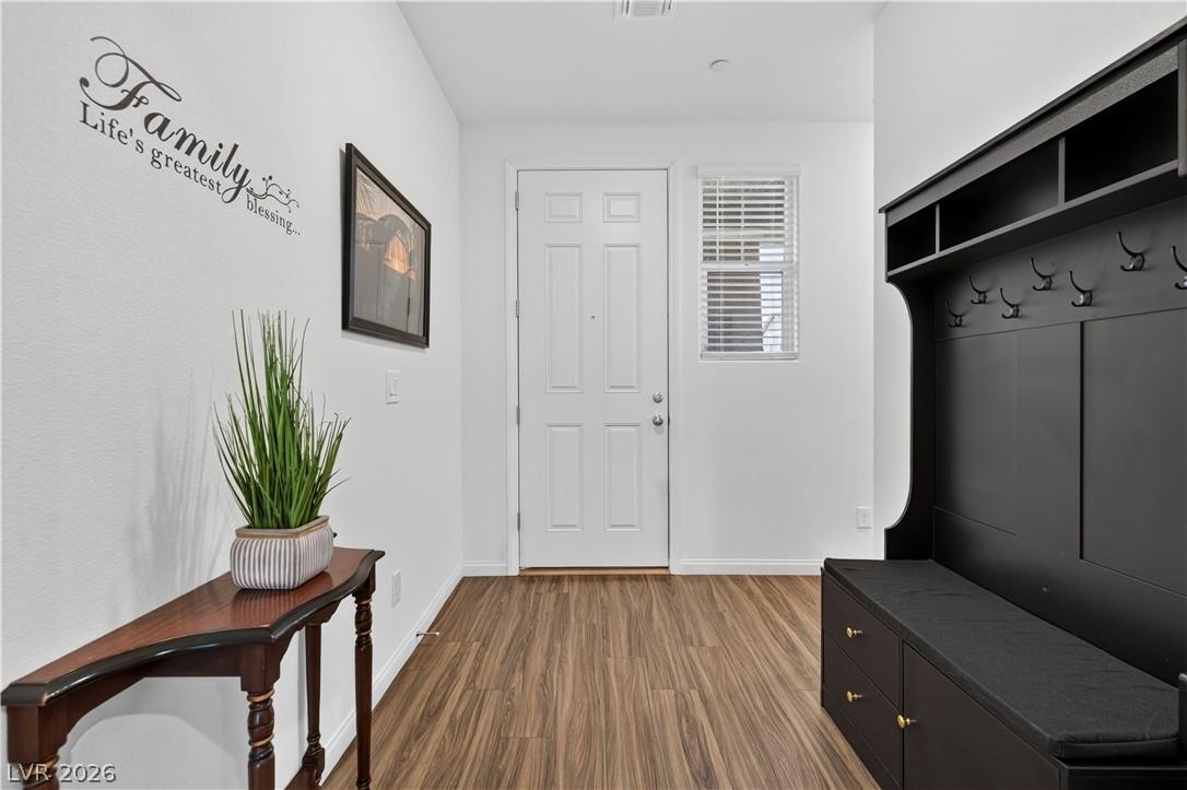 Image 4: A welcoming entryway boasts practical built-in sto