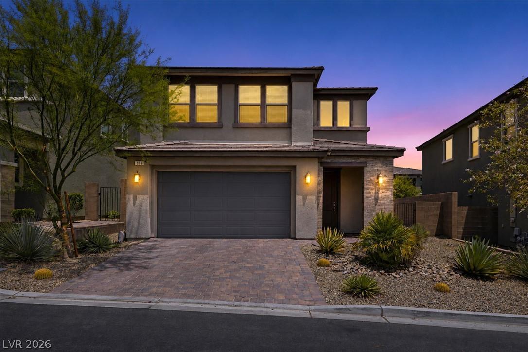 Image 1: A desert-friendly landscape surrounds this contemp