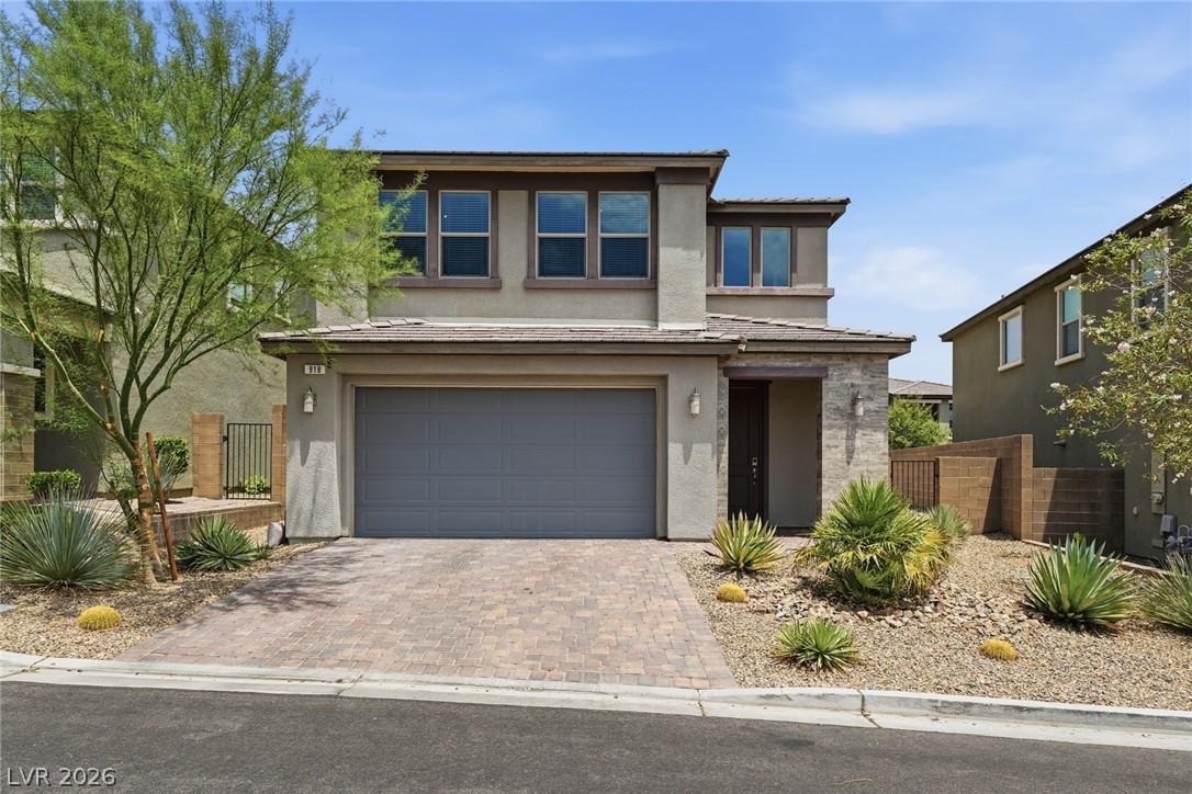 Image 2: A contemporary desert-friendly landscape adorns th