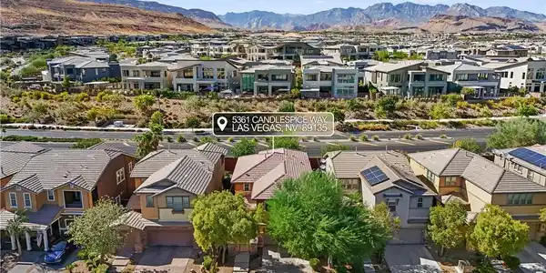 Image 3: Dramatic mountain peaks frame a sprawling neighbor