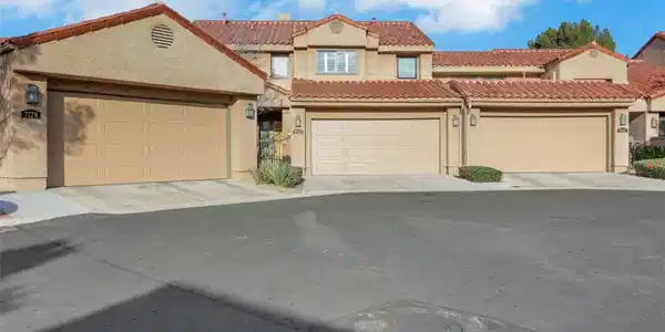 Image 2: Spanish tile roofing and stucco siding accent the