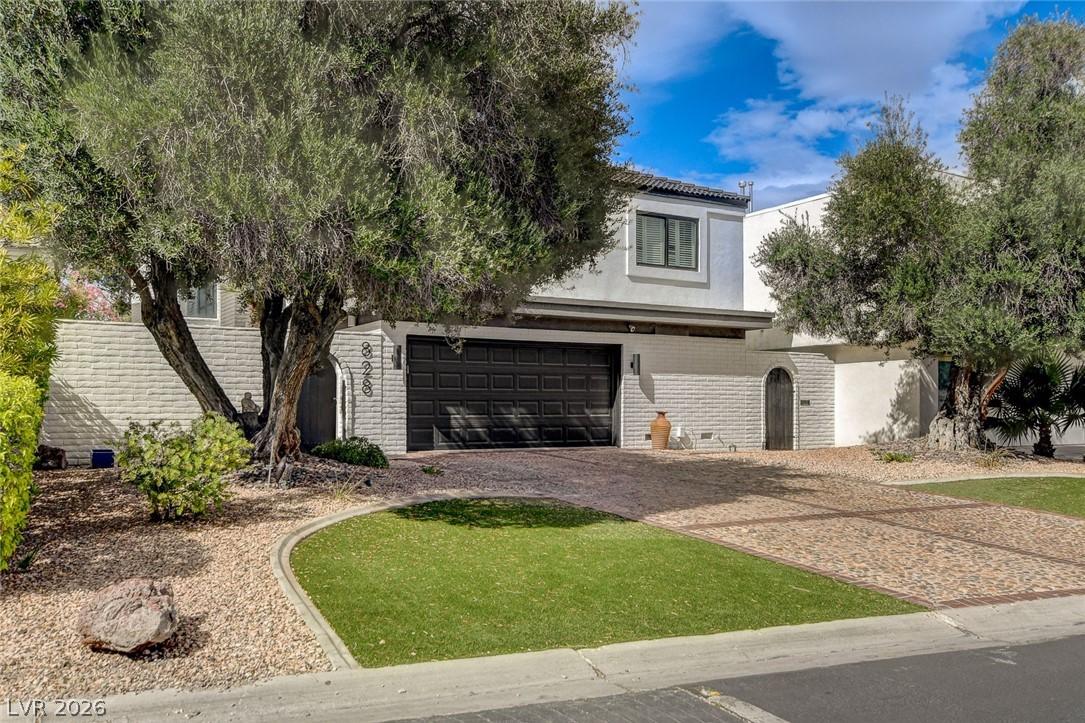Image 3: This charming home offers a well-maintained exteri