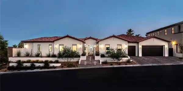 Image 3: A terracotta-tiled roof and desert landscaping cre