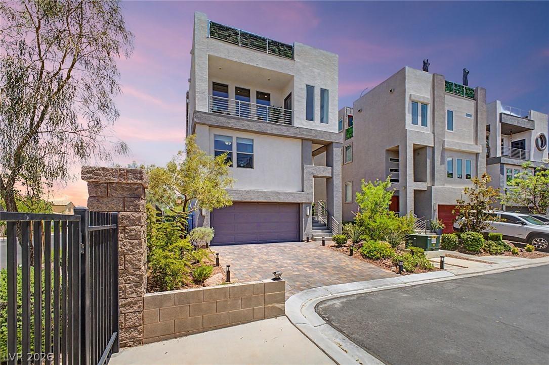Image 2: A contemporary multi-story residence boasts privat