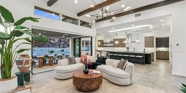 Image 3: Exposed wood beams and modern tile flooring define