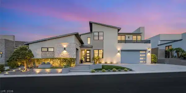 Image 4: Dramatic rooflines and stone accents define this c
