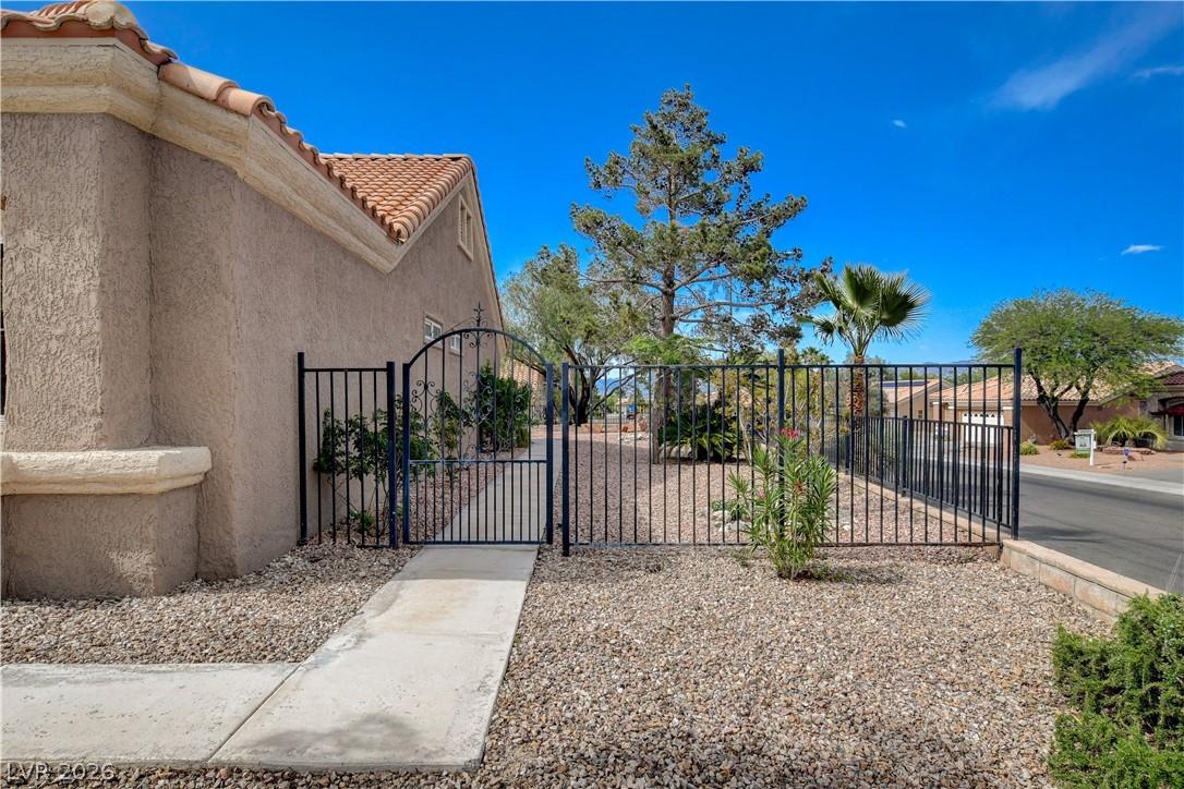 Image 4: This property features  a charming wrought iron fe