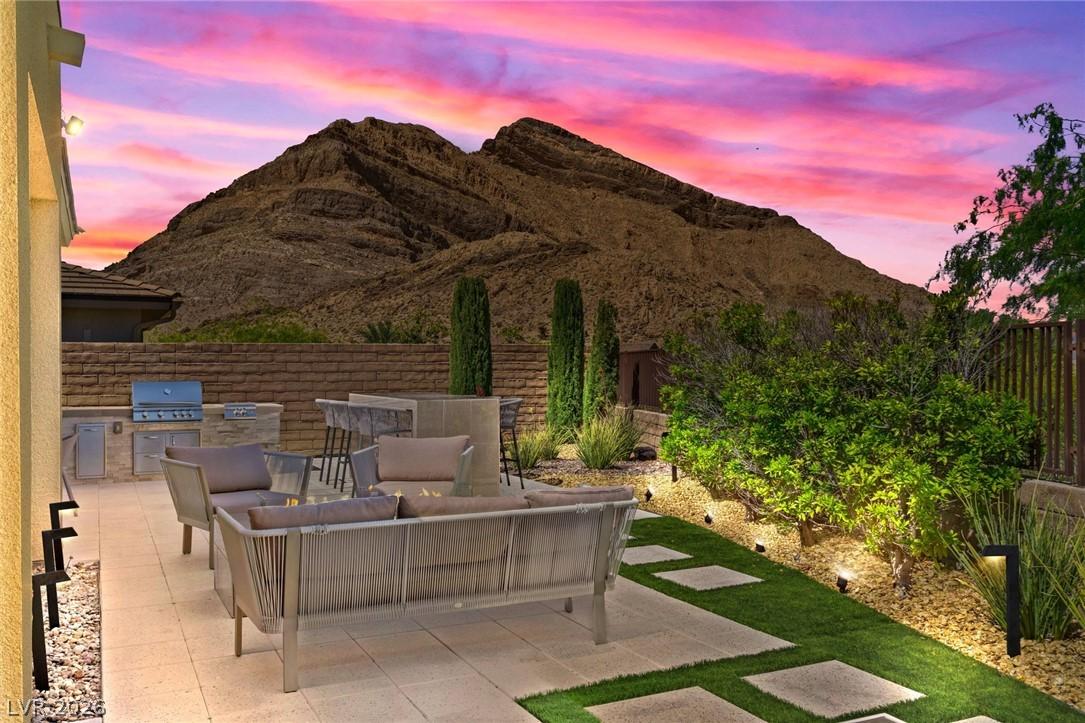 Image 2: An inviting outdoor living space features an integ