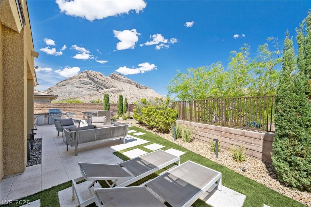 Image 3: An inviting outdoor patio with lounge seating offe