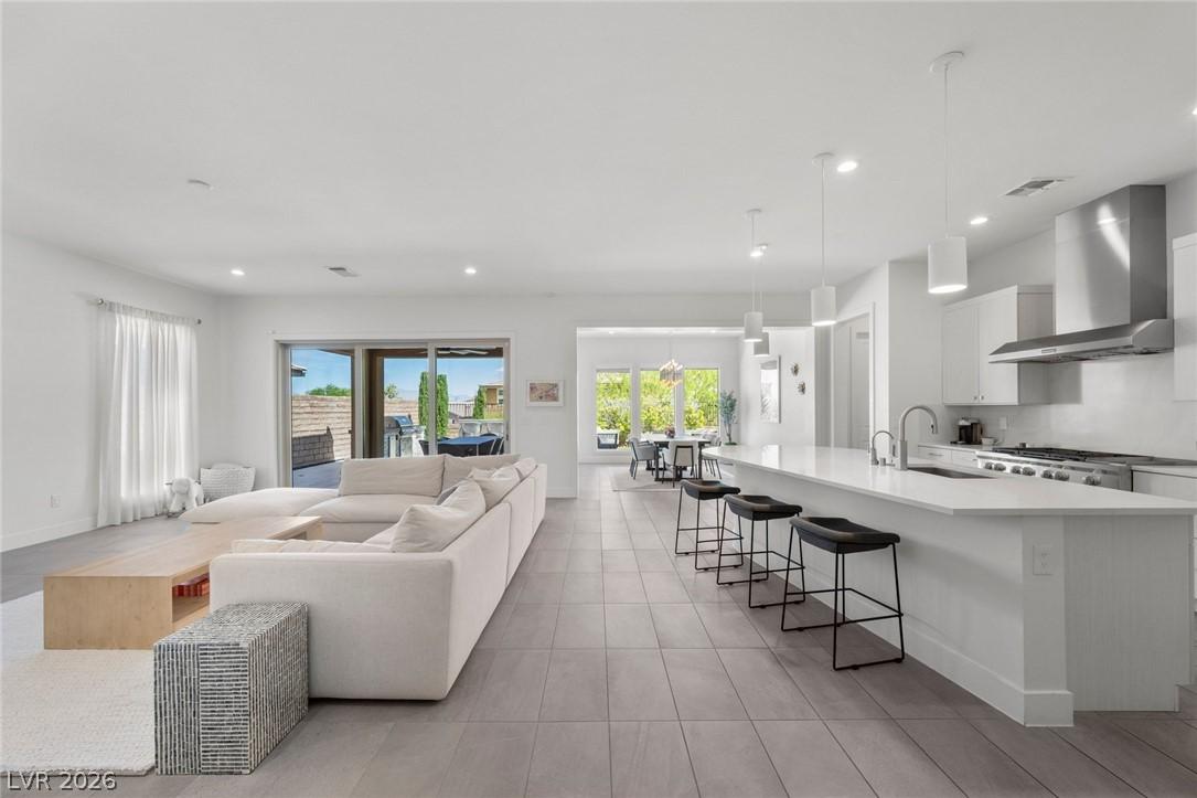 Image 4: An open-concept living space integrates a well-app