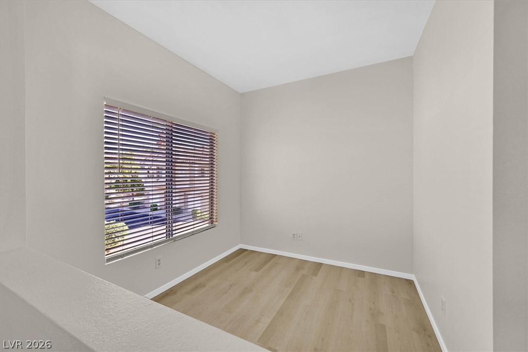 Image 4: A well-lit room features durable laminate flooring