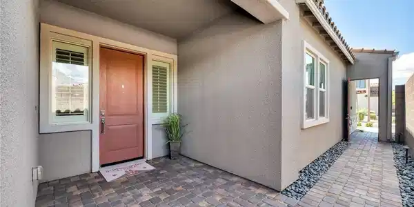 Image 3: An inviting covered entryway features structured p