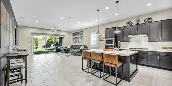 Image 4: An open-concept living area flows seamlessly into