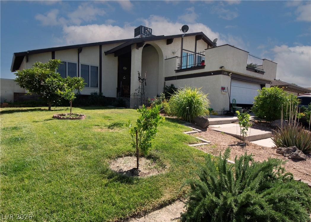 Image 1: A classic ranch home showcasing a neat lawn and lo