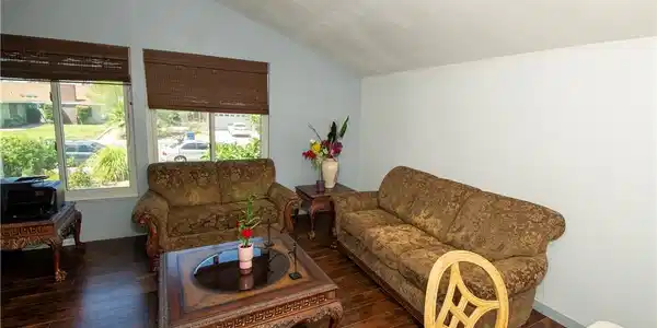 Image 4: Hardwood floors and generous windows elevate this