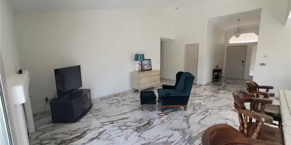 Image 4: Voluminous ceilings elevate this living area featu
